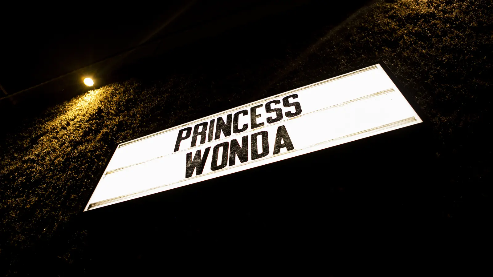 A lit marquee sign reading Princess Wonda